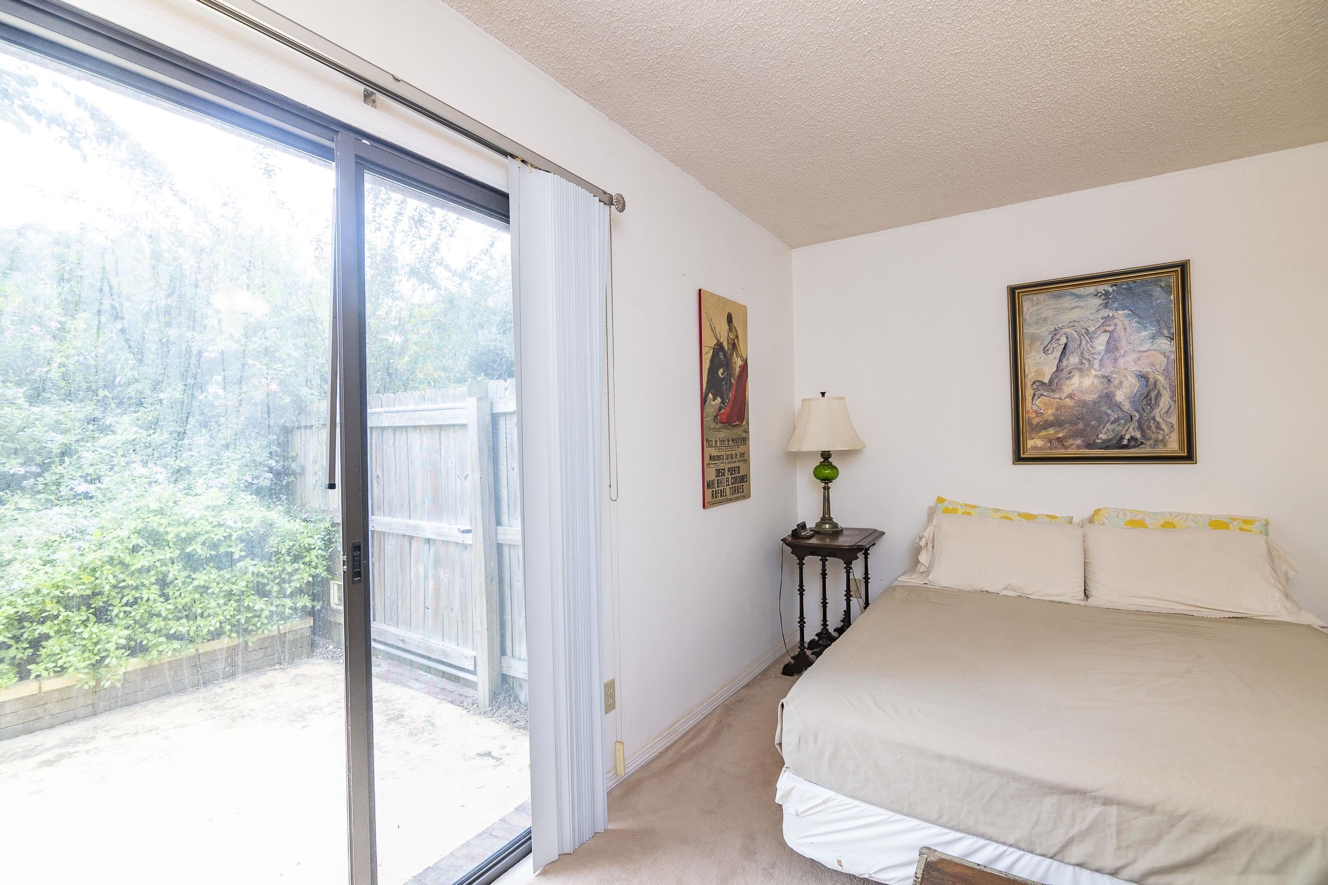 303 Cypress Road St. Augustine, FL 32086 - Photo 29 of 33 a bedroom with a large bed and a large window