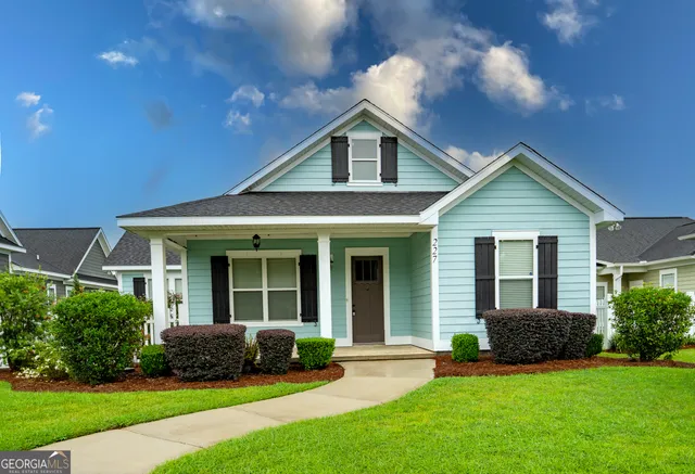 a front view of a house with a yard
