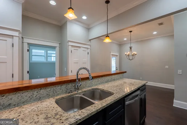 a kitchen with a sink and a window