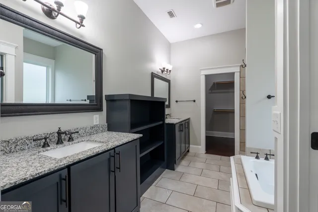 a kitchen with lots of counter space and appliances