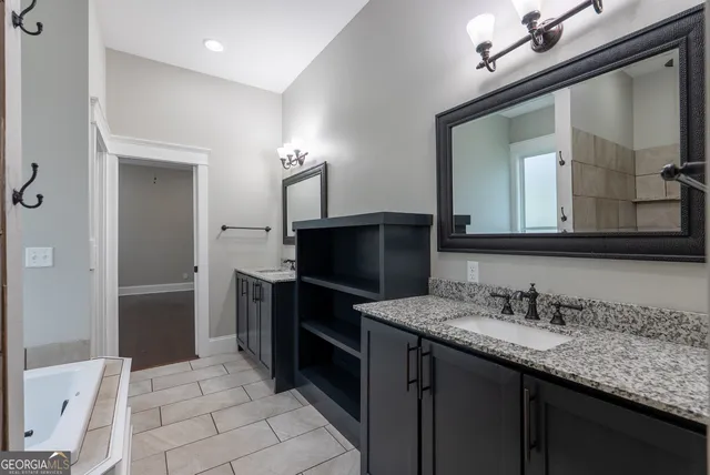 a bathroom with a bathtub and a shower