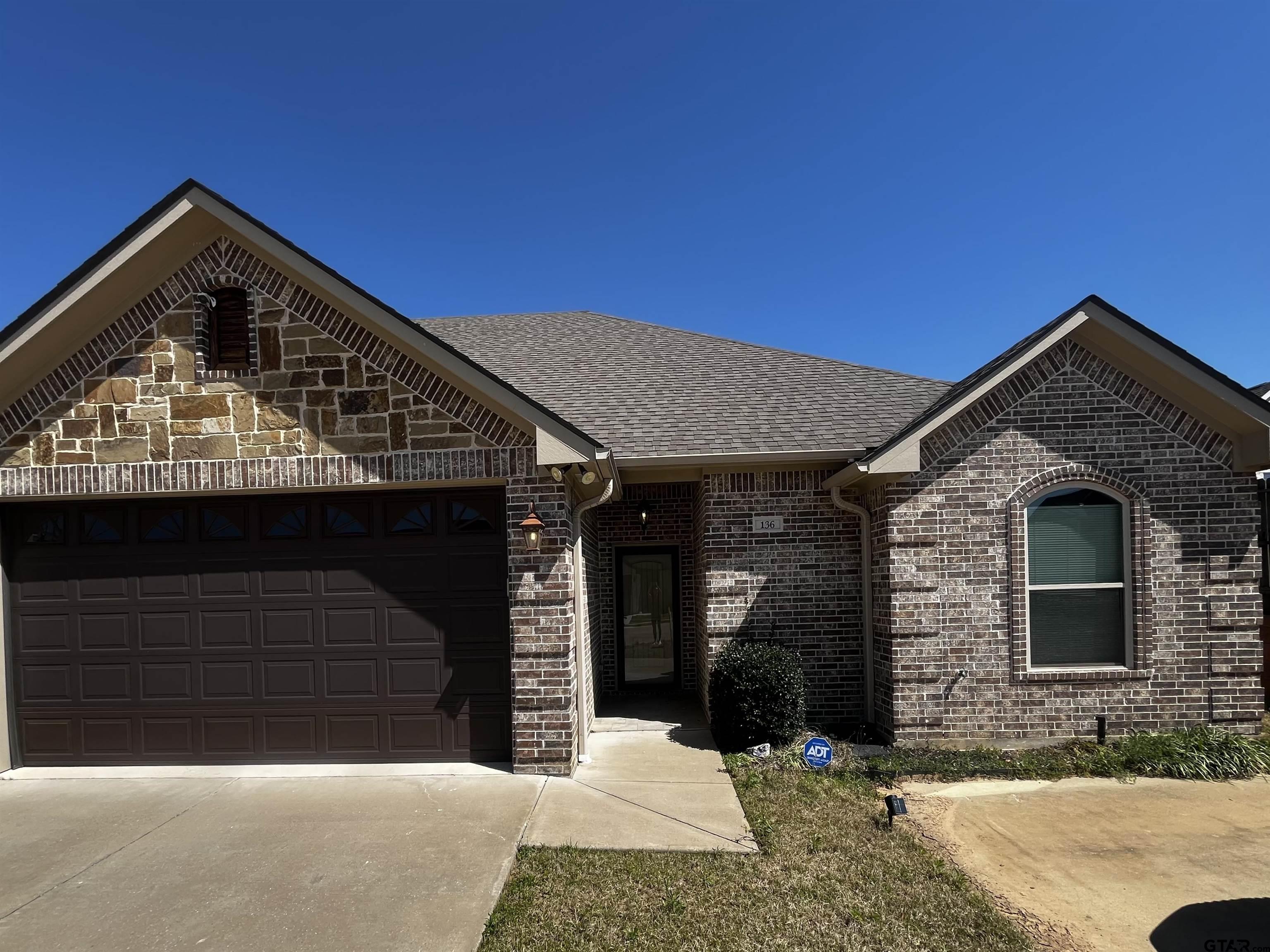 136 Letha Court Tyler, TX 75702 - Photo 2 of 34 a front view of a house with balcony