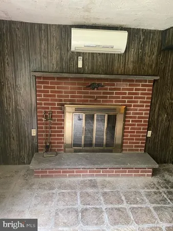 a view of fireplace and wooden door