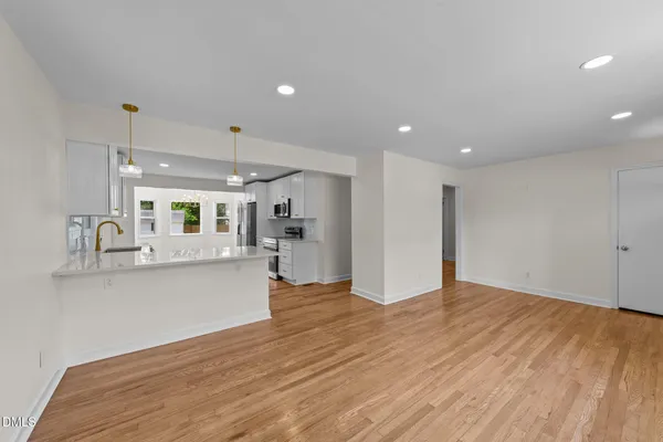 a view of kitchen with wooden floor