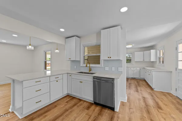 a large kitchen with cabinets