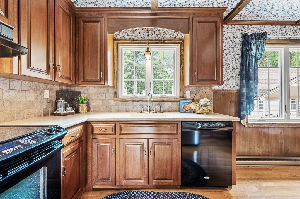 380 Quaker Street Northbridge, MA 01534 - Photo 14 of 42 a kitchen with stainless steel appliances granite countertop a stove and a sink