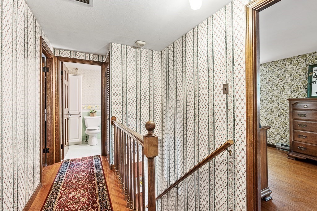 380 Quaker Street Northbridge, MA 01534 - Photo 22 of 42 a view of a hallway with wooden floor and windows