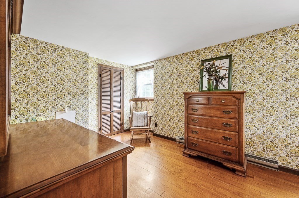 380 Quaker Street Northbridge, MA 01534 - Photo 25 of 42 a view of a bedroom with cabinets and wooden floor