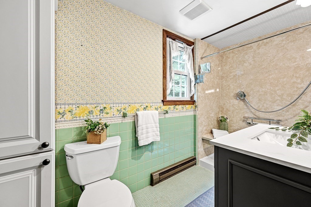 380 Quaker Street Northbridge, MA 01534 - Photo 28 of 42 a bathroom with a toilet sink and mirror
