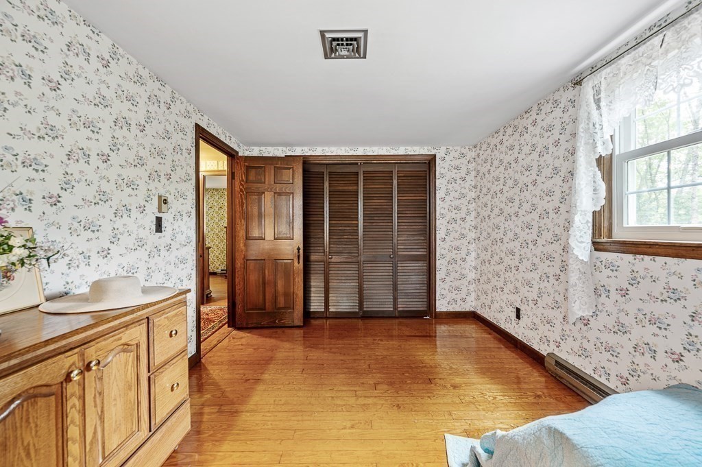 380 Quaker Street Northbridge, MA 01534 - Photo 30 of 42 a view of empty room with wooden floor and fan