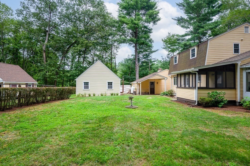 380 Quaker Street Northbridge, MA 01534 - Photo 35 of 42 a front view of a house with a yard and trees