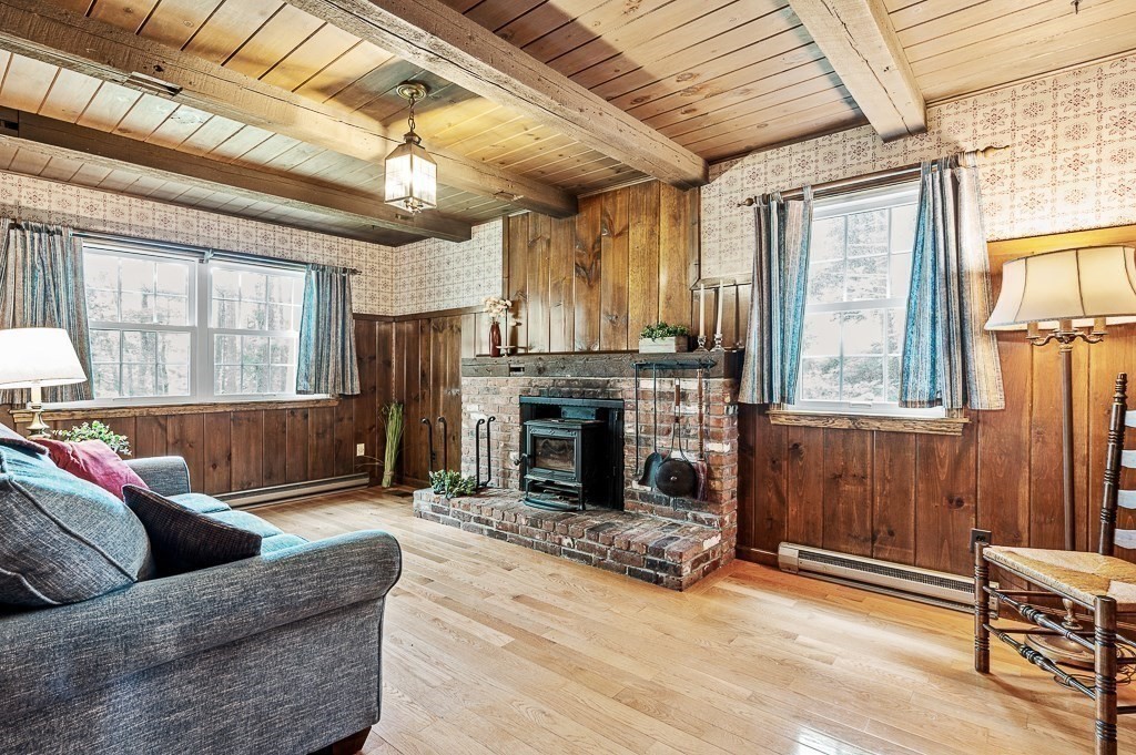 380 Quaker Street Northbridge, MA 01534 - Photo 10 of 42 a living room with furniture and a fireplace