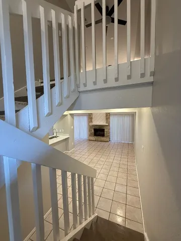 a view of a kitchen with wooden floor and cabinets