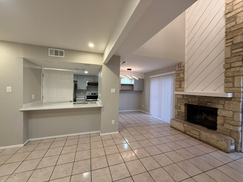 1606 Waterloo Trail, Unit A Austin, TX 78704 - Photo 4 of 17 a open kitchen with cabinets and fireplace
