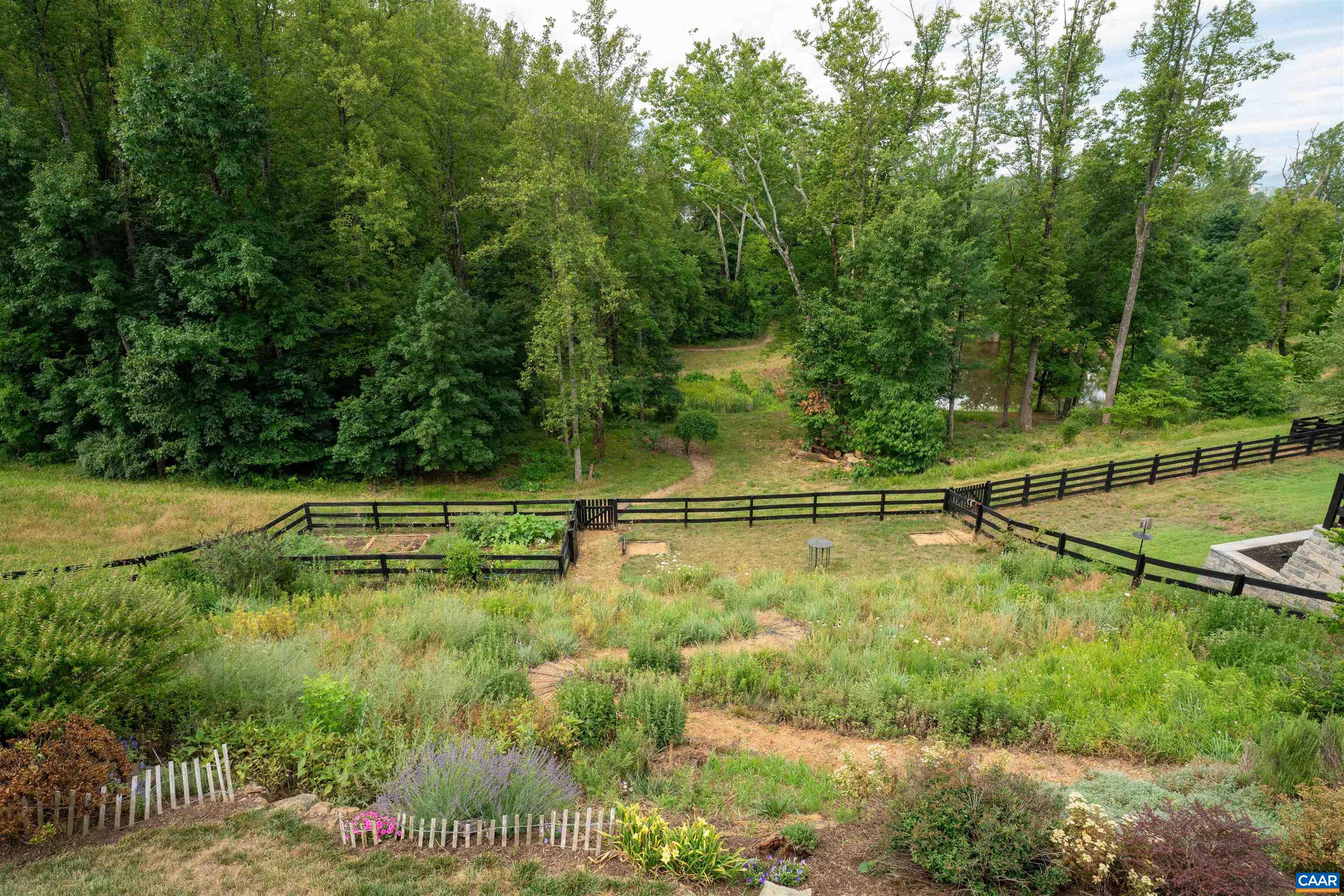 2246 Hyland Ridge Drive Charlottesville, VA 22911 - Photo 7 of 53 Fenced and landscaped backyard with path to community pond.