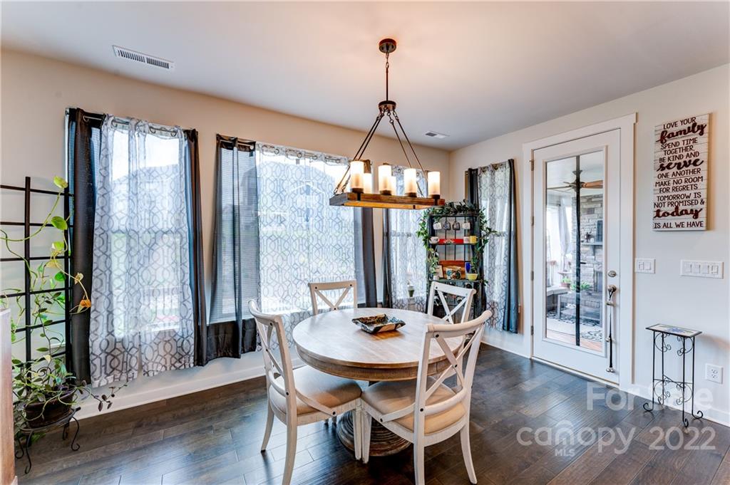 1198 Therns Ferry Drive Fort Mill, SC 29708 - Photo 12 of 48 a view of a dining room with furniture window and wooden floor