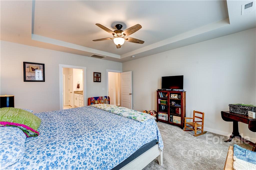 1198 Therns Ferry Drive Fort Mill, SC 29708 - Photo 14 of 48 a bedroom with a bed and a book shelf