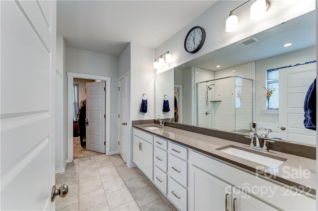 1198 Therns Ferry Drive Fort Mill, SC 29708 - Photo 15 of 48 a spacious bathroom with double vanity and a mirror