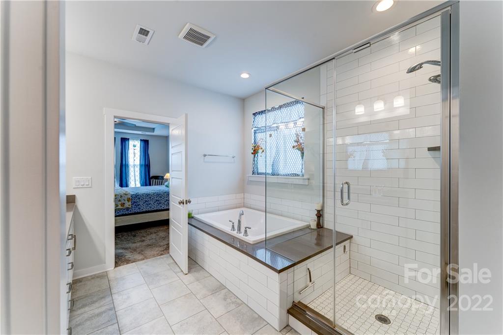 1198 Therns Ferry Drive Fort Mill, SC 29708 - Photo 16 of 48 a bathroom with a tub a mirror and a shower