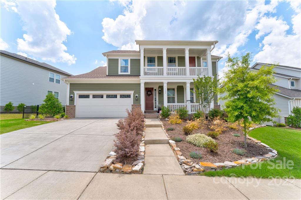 1198 Therns Ferry Drive Fort Mill, SC 29708 - Photo 2 of 48 a front view of a house with garden