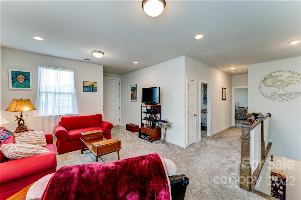 1198 Therns Ferry Drive Fort Mill, SC 29708 - Photo 21 of 48 a living room with furniture a window and a flat screen tv
