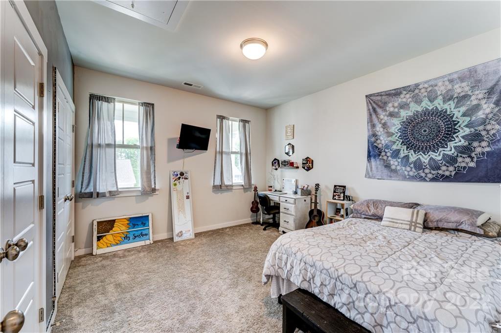 1198 Therns Ferry Drive Fort Mill, SC 29708 - Photo 22 of 48 a bed room with a bed and a television
