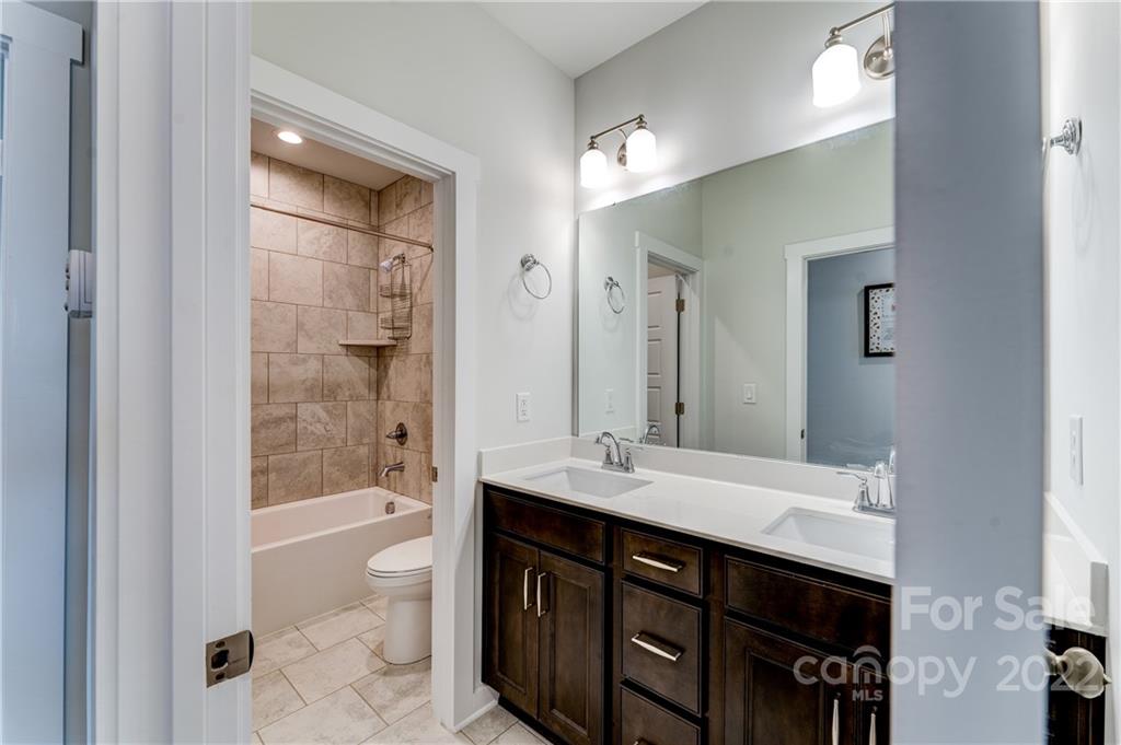 1198 Therns Ferry Drive Fort Mill, SC 29708 - Photo 23 of 48 a bathroom with a bathtub double vanity sink and a shower