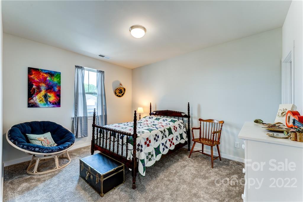 1198 Therns Ferry Drive Fort Mill, SC 29708 - Photo 24 of 48 a bedroom with furniture and a rug