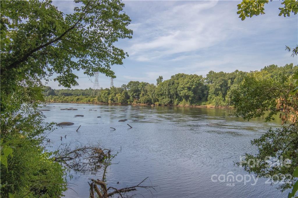 1198 Therns Ferry Drive Fort Mill, SC 29708 - Photo 47 of 48 a view of a lake with beach and trees