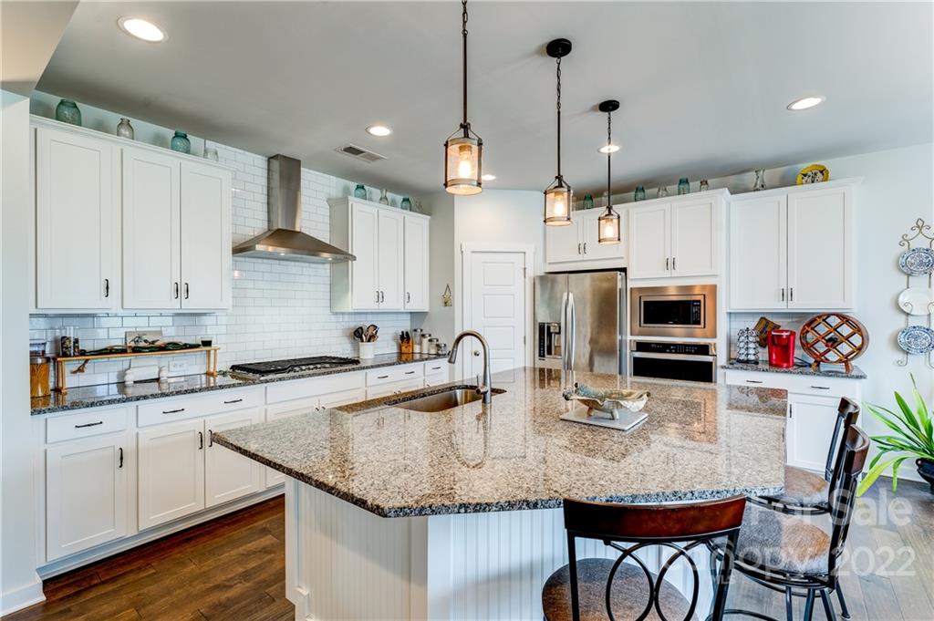1198 Therns Ferry Drive Fort Mill, SC 29708 - Photo 10 of 48 a kitchen with granite countertop a sink cabinets and stainless steel appliances