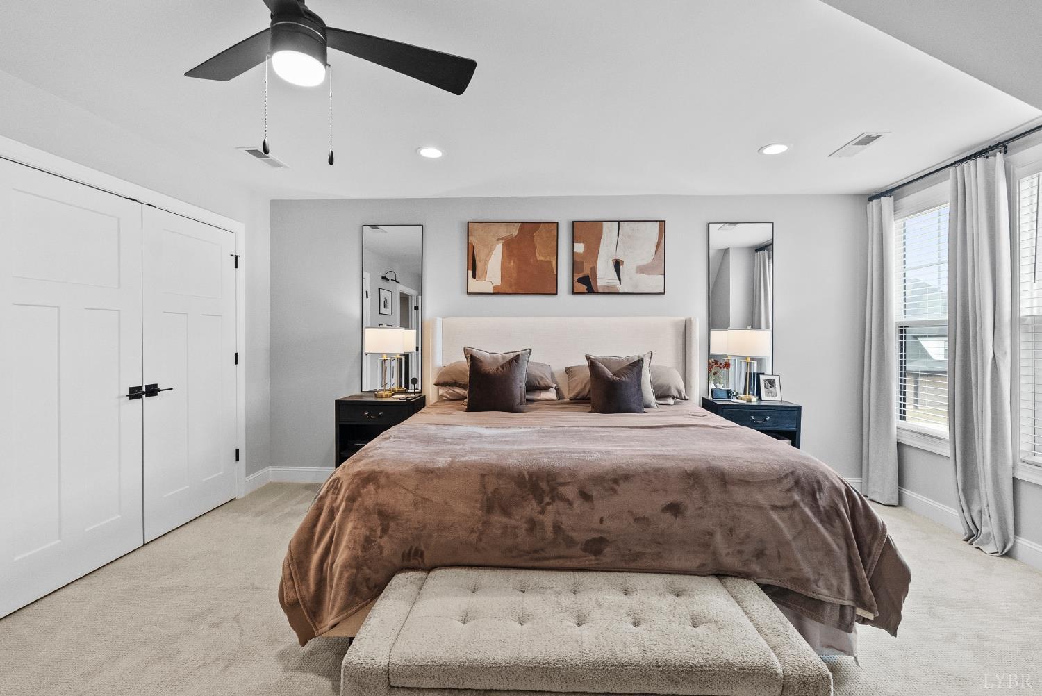 1019 North Westyn Loop Forest, VA 24551 - Photo 27 of 51 a bedroom with a large bed and a chandelier