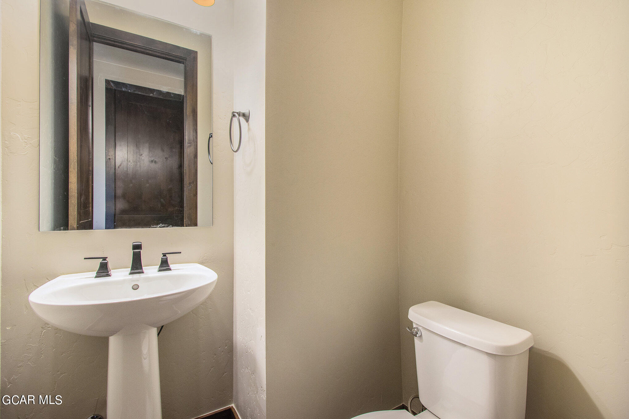 141 Homestead Loop Fraser, CO 80442 - Photo 11 of 27 a bathroom with a sink toilet and mirror