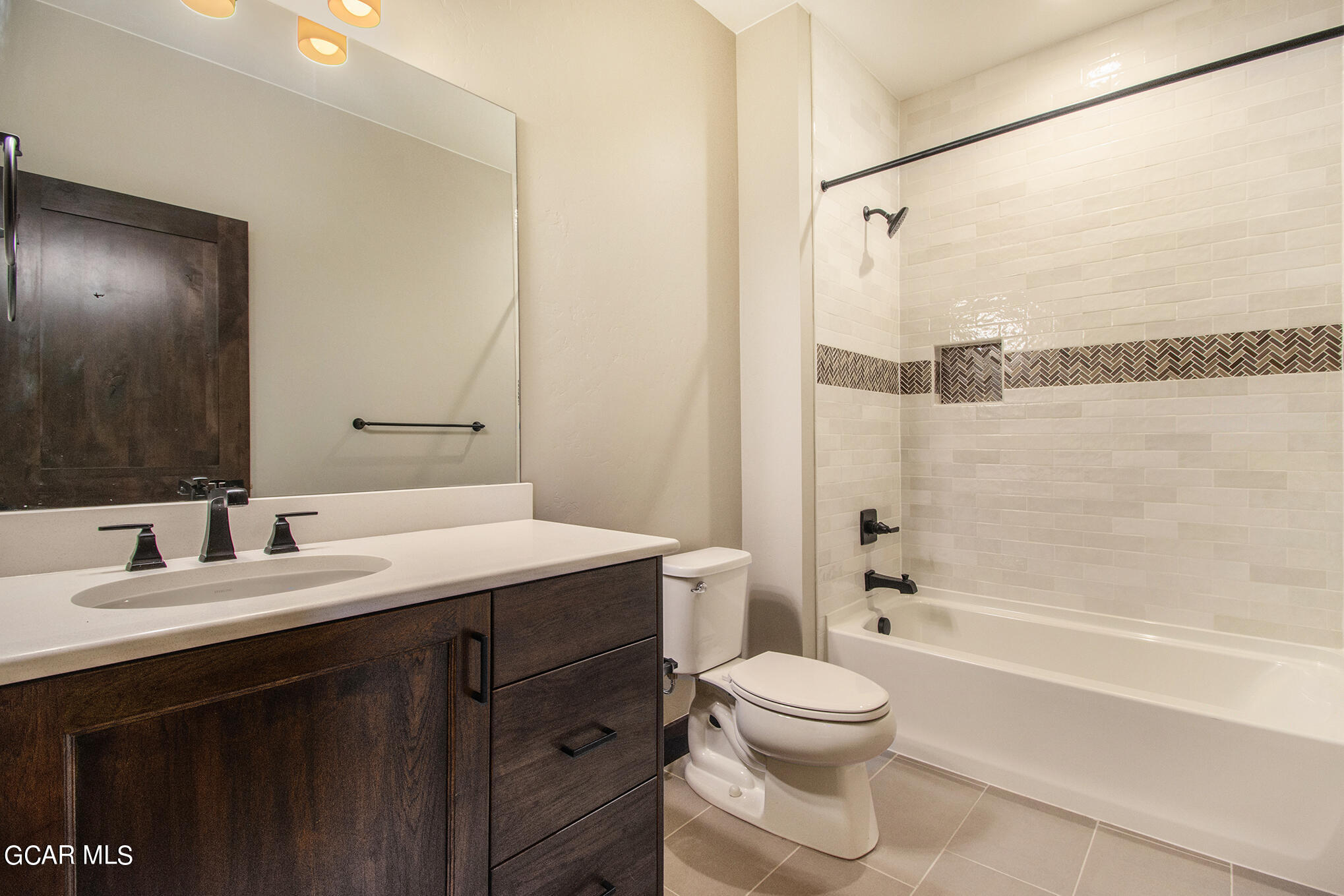 141 Homestead Loop Fraser, CO 80442 - Photo 20 of 27 a bathroom with a granite countertop sink toilet and shower