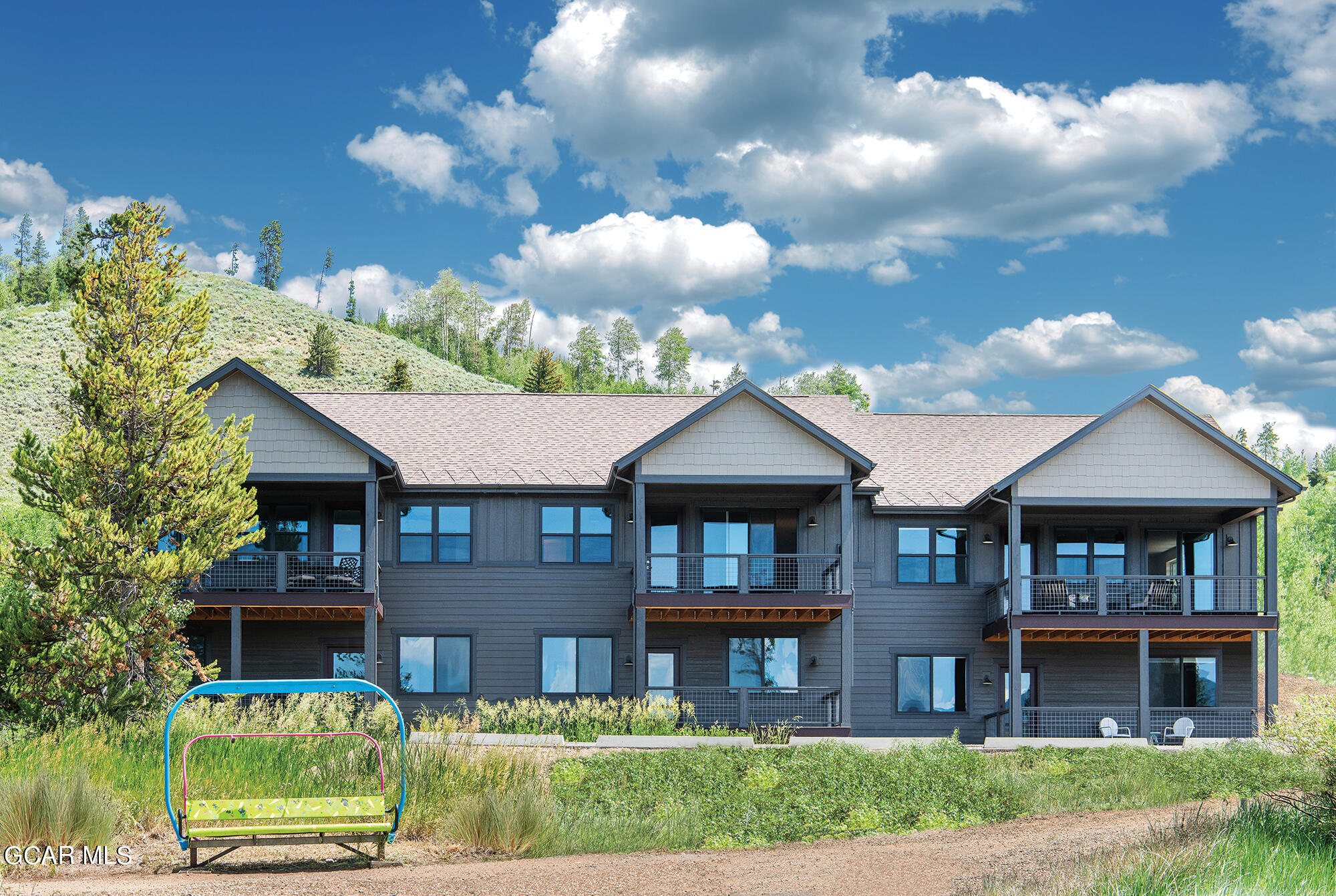 141 Homestead Loop Fraser, CO 80442 - Photo 3 of 27 a front view of a house with yard and green space