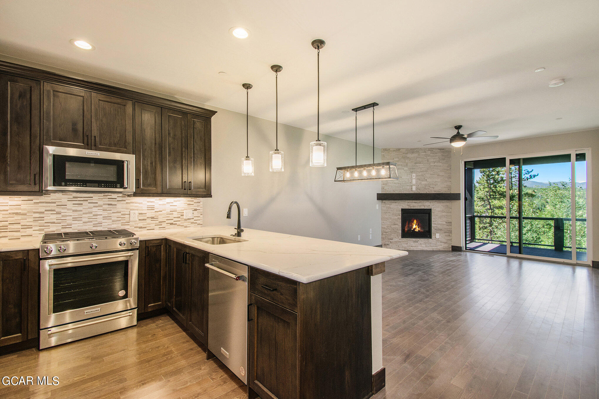 141 Homestead Loop Fraser, CO 80442 - Photo 5 of 27 a kitchen with a sink stove and microwave