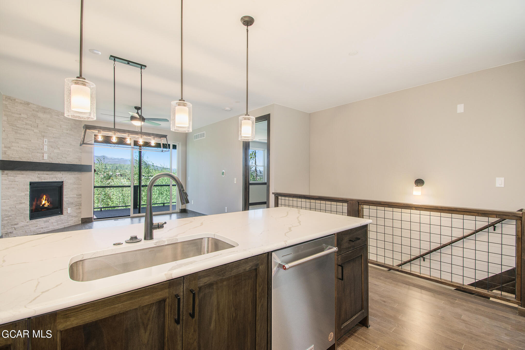 141 Homestead Loop Fraser, CO 80442 - Photo 6 of 27 a kitchen with a sink and a wooden floor