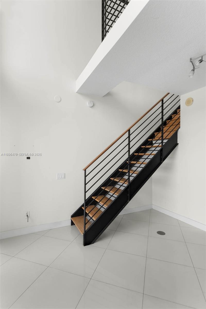 60 Southwest 13th Street, Unit 3213 Miami, FL 33130 - Photo 14 of 18 a room with gym equipment