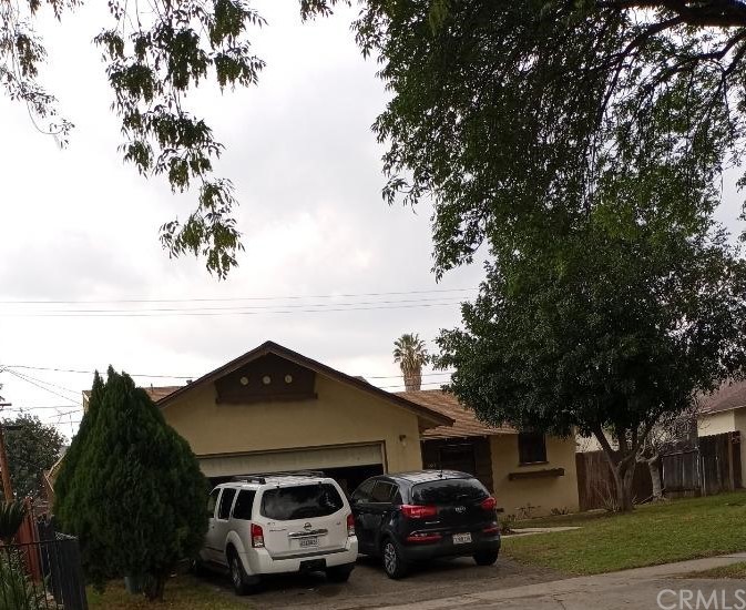 8647 Colorado Avenue Riverside, CA 92504 - Photo 1 of 1 a car parked in front of a house