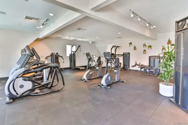 a view of a livingroom with furniture wooden floor and windows