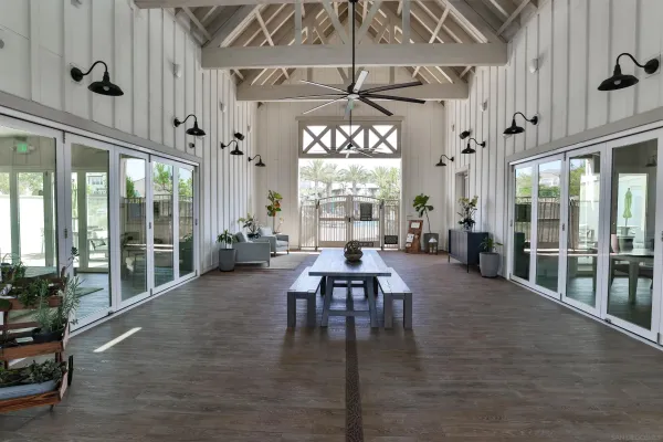 a view of a dining room with furniture and a large window