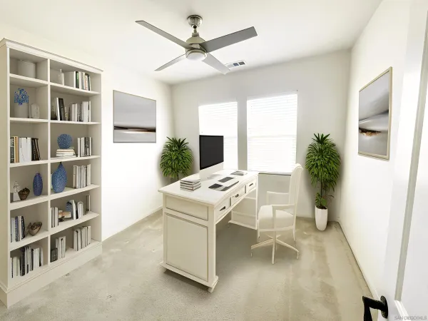 a view of a workspace with furniture and a bookshelf
