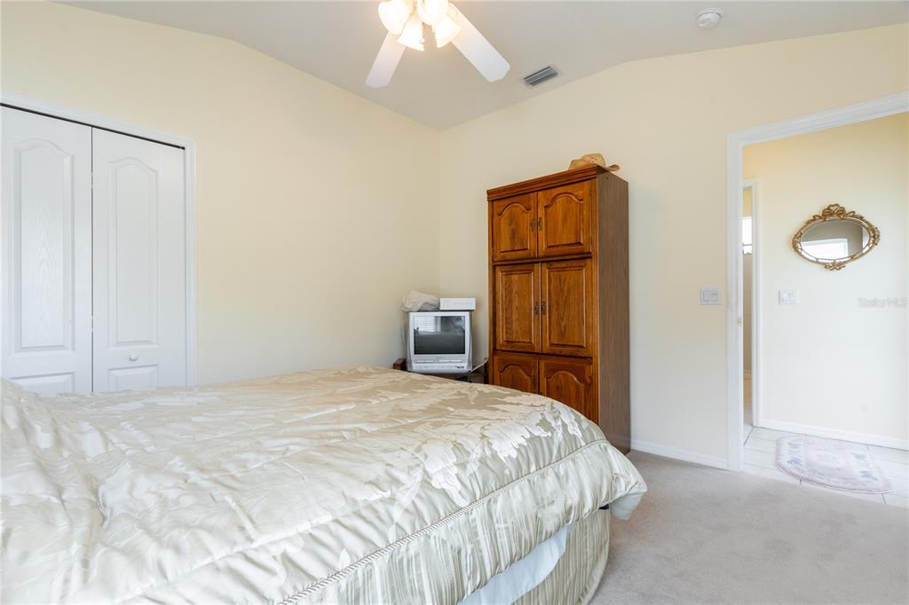 1812 Flower Branch Way Valrico, FL 33594 - Photo 31 of 42 a bedroom with a bed and a cabinets