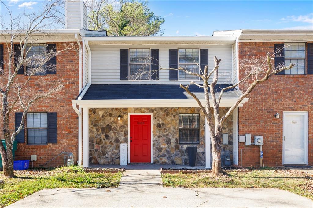 1468 Springleaf Circle Southeast Smyrna, GA 30080 - Photo 1 of 1 a front view of a house with garden