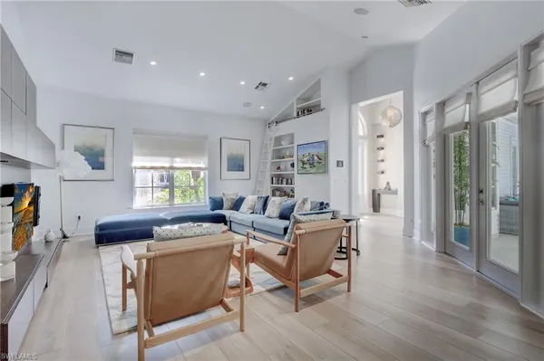 a living room with furniture and a window