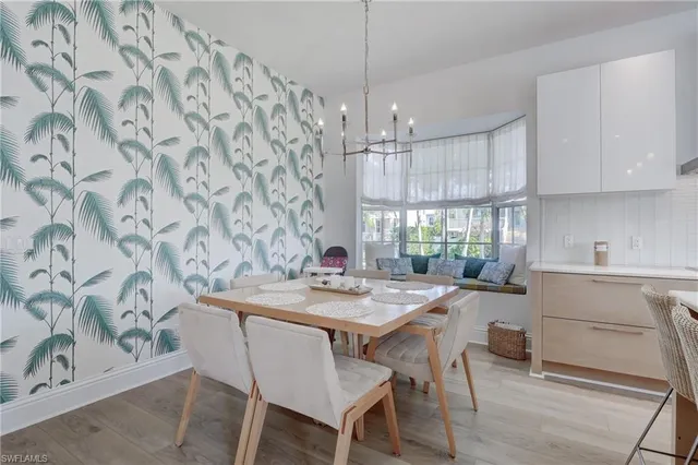 a kitchen with a table and chairs in it