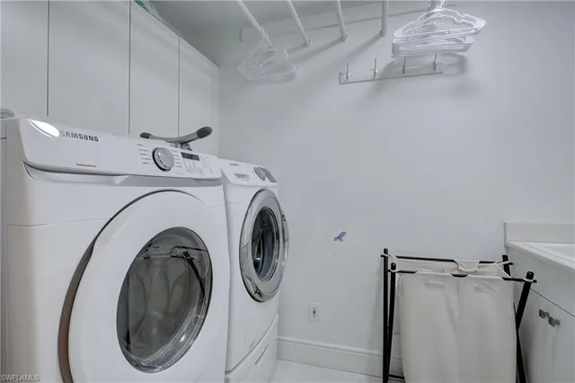 a bedroom with a bed chair and a window