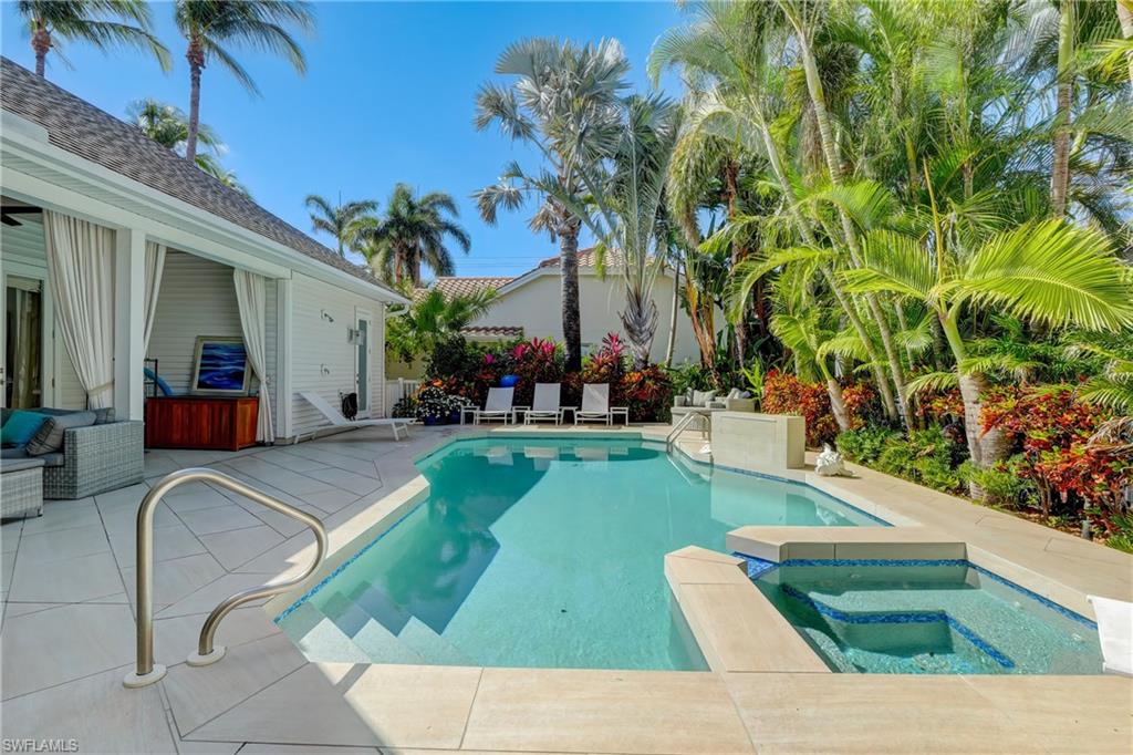 687 9th Avenue South Naples, FL 34102 - Photo 33 of 39 a view of outdoor space yard deck patio and swimming pool