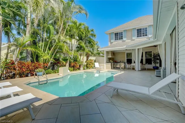 a kitchen with a table and chairs