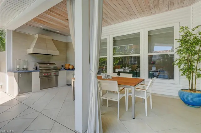 a view of empty room with air conditioner and ceiling fan