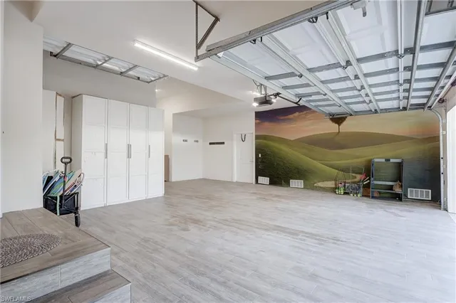 a aerial view of a house with a big yard and potted plants